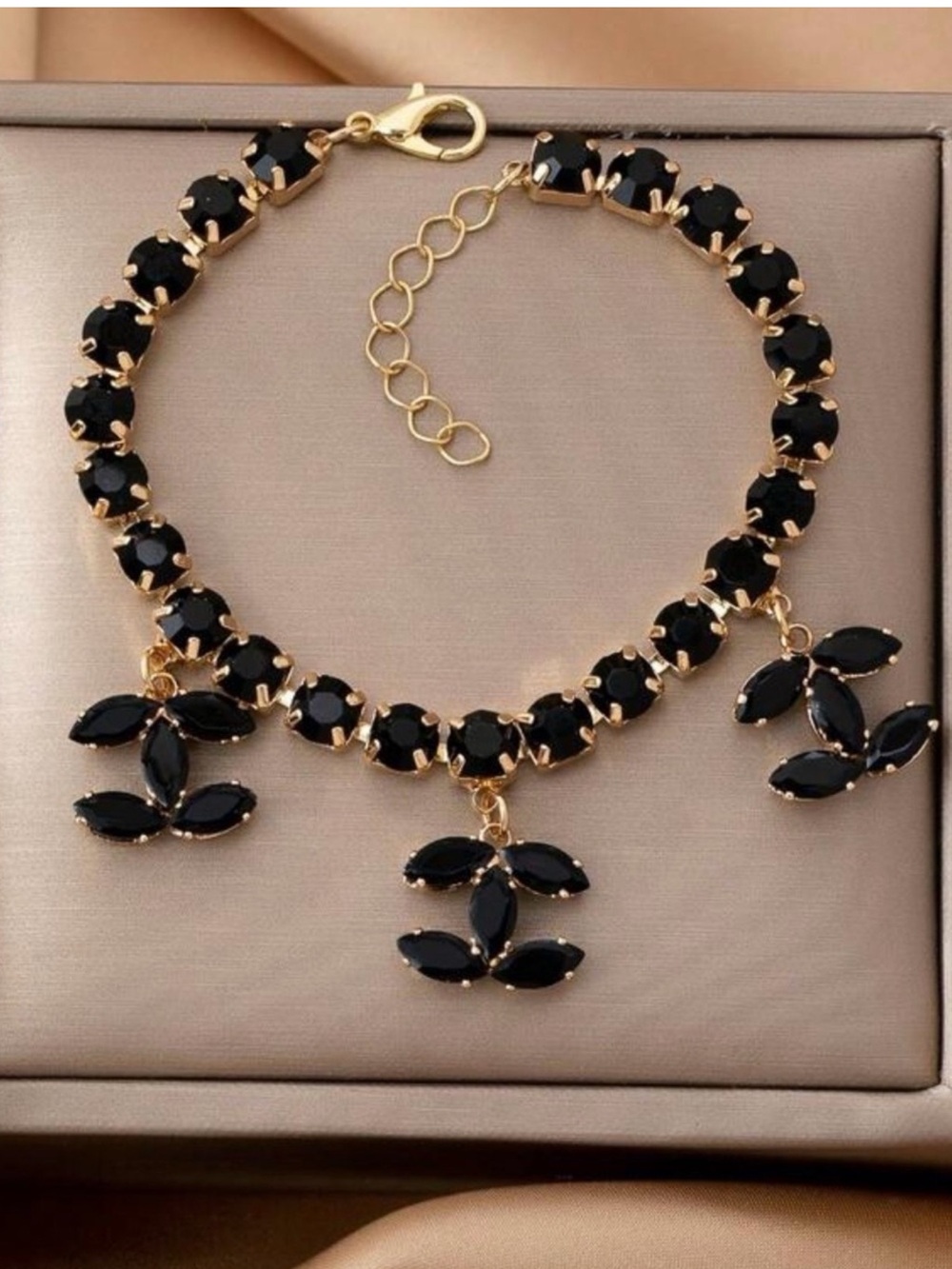 Macy's Gold Plated Bracelet with Black Stones and Floral Charms